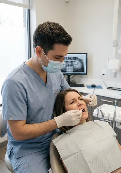 Close view of an emergency dental exam for a painful damaged tooth